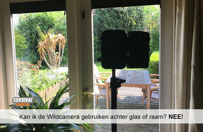 Kan ik de Wildcamera gebruiken achter glas of raam? NEE!